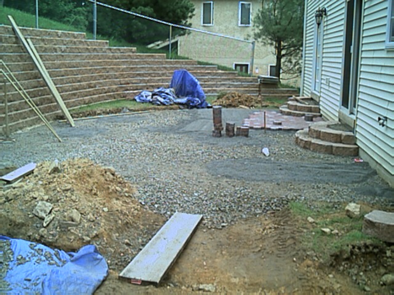 After evenly spreading stone fill, leveling it off, and making the rounded steps we started the pavers.