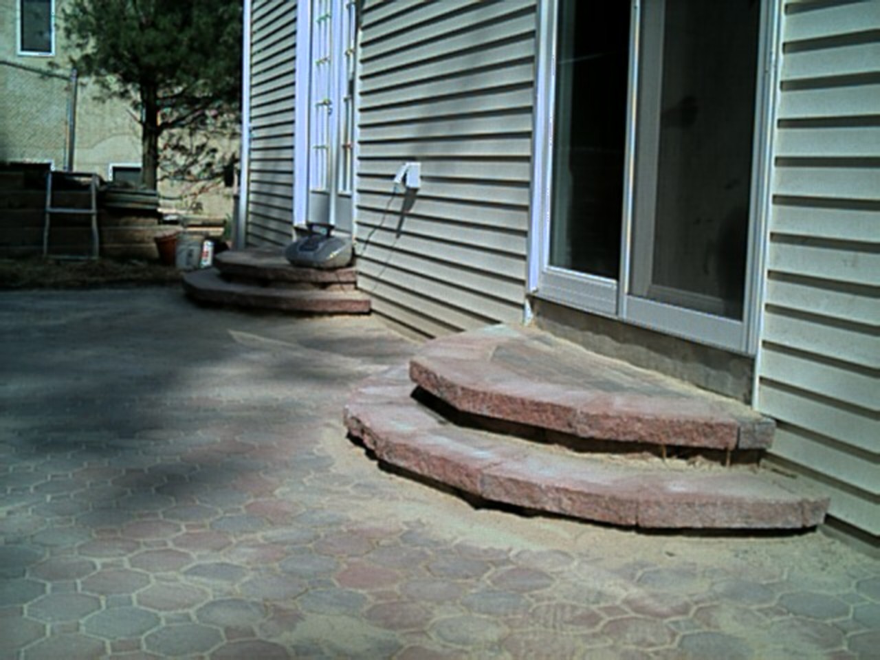 The steps are completely finished by putting the caps on, and the patio is almost done too!