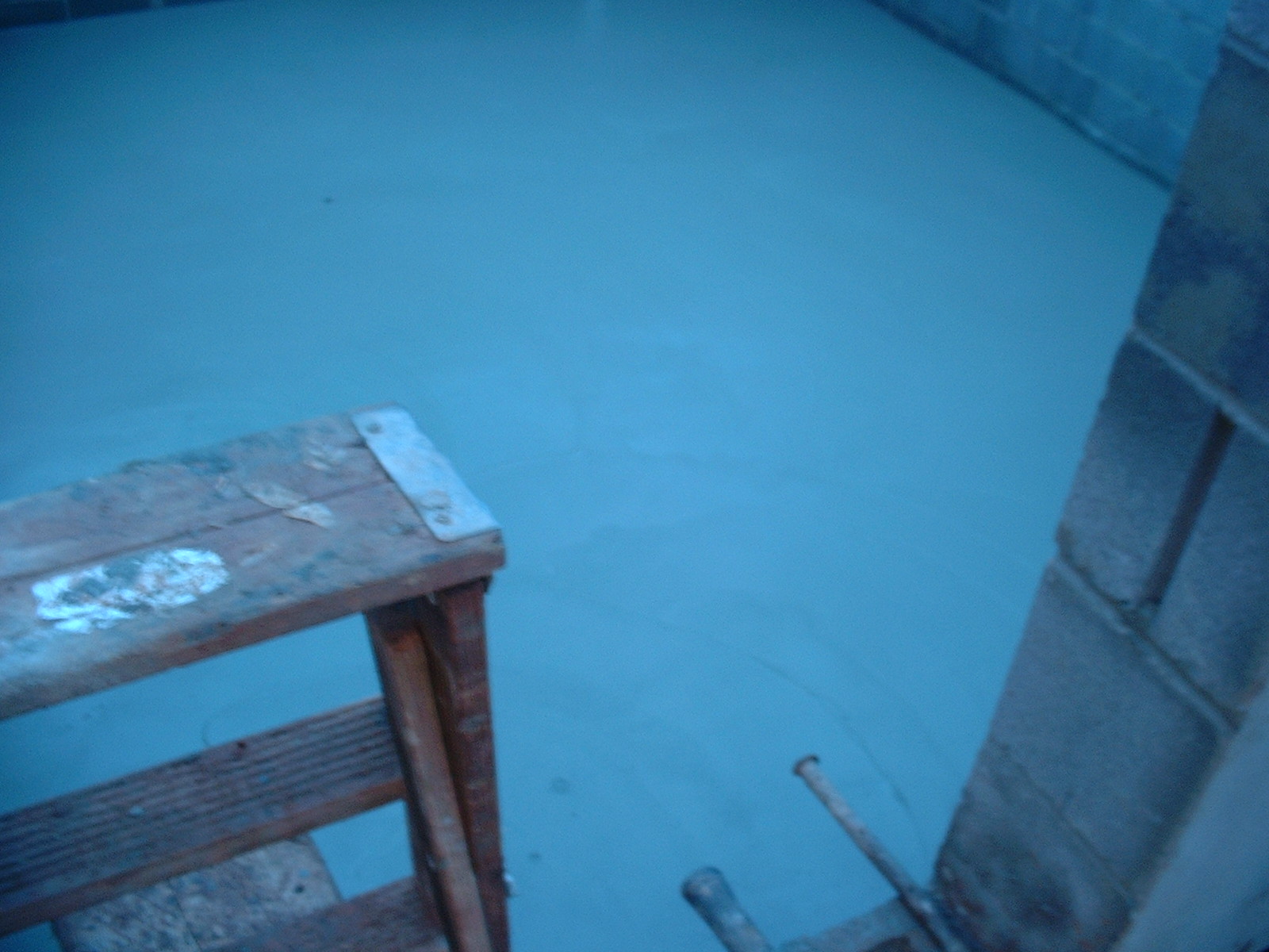 Another picture of the basement floor. The blue color is the tarp.