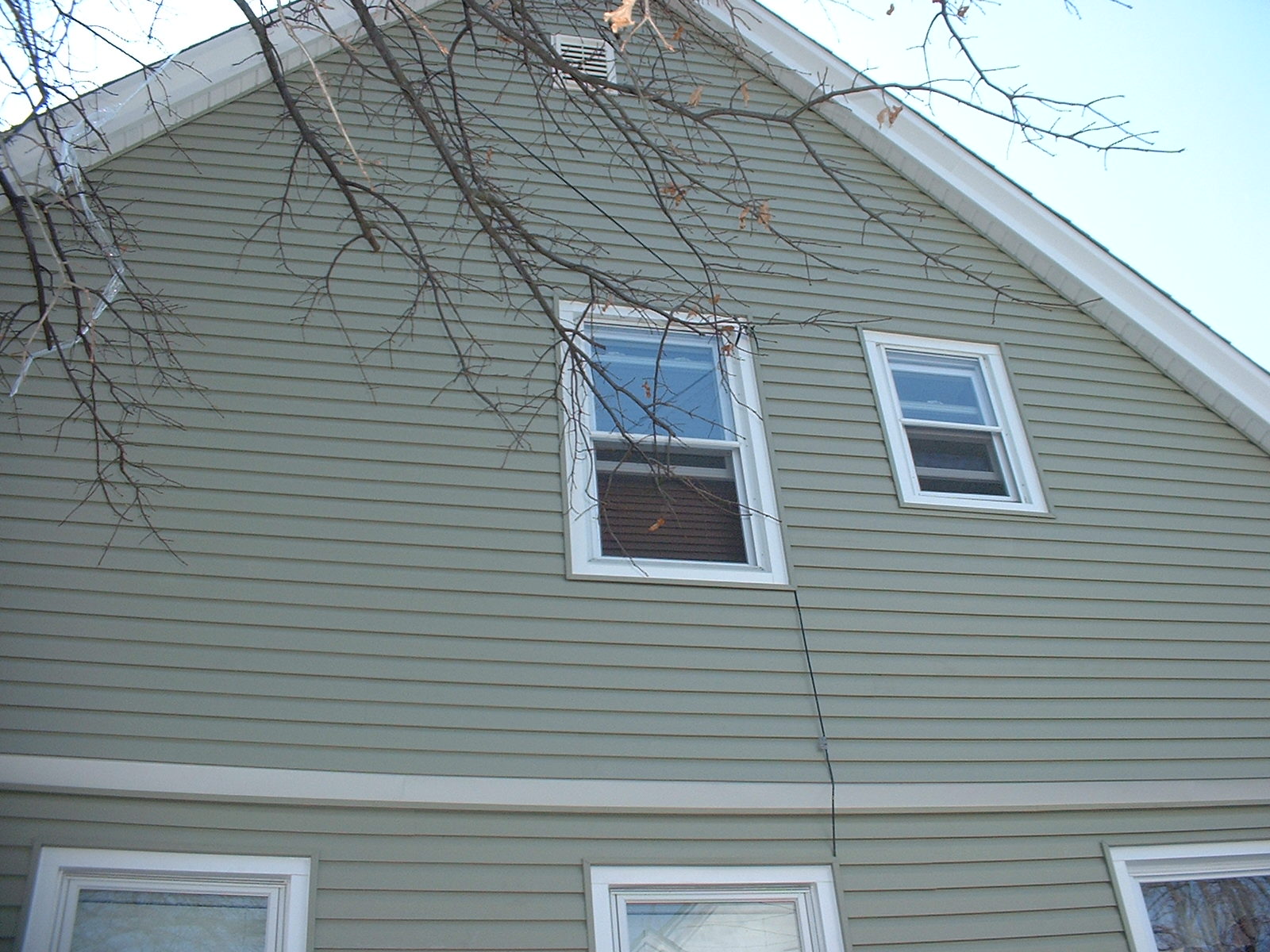 After taking down the existing siding on the gable end, we found old roofing, which had to be removed also.