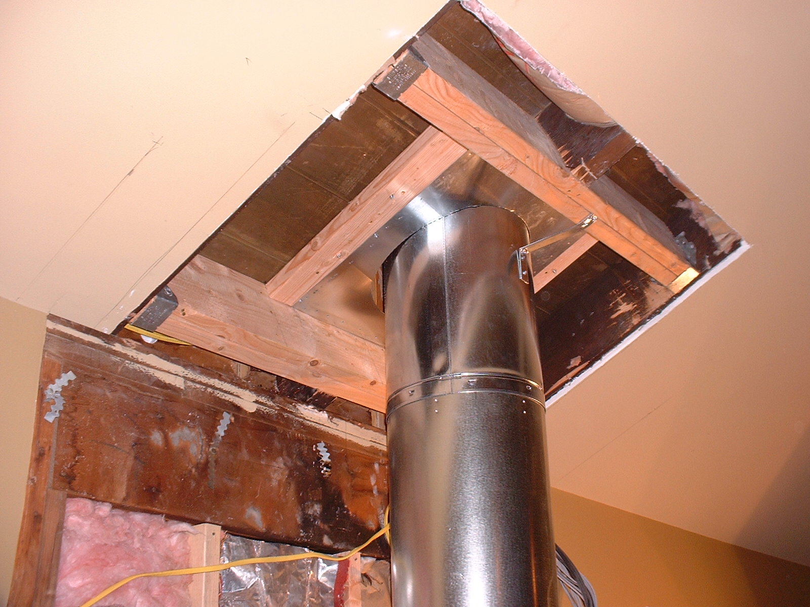 The chimney stack had to go through the cieling and onto the roof.