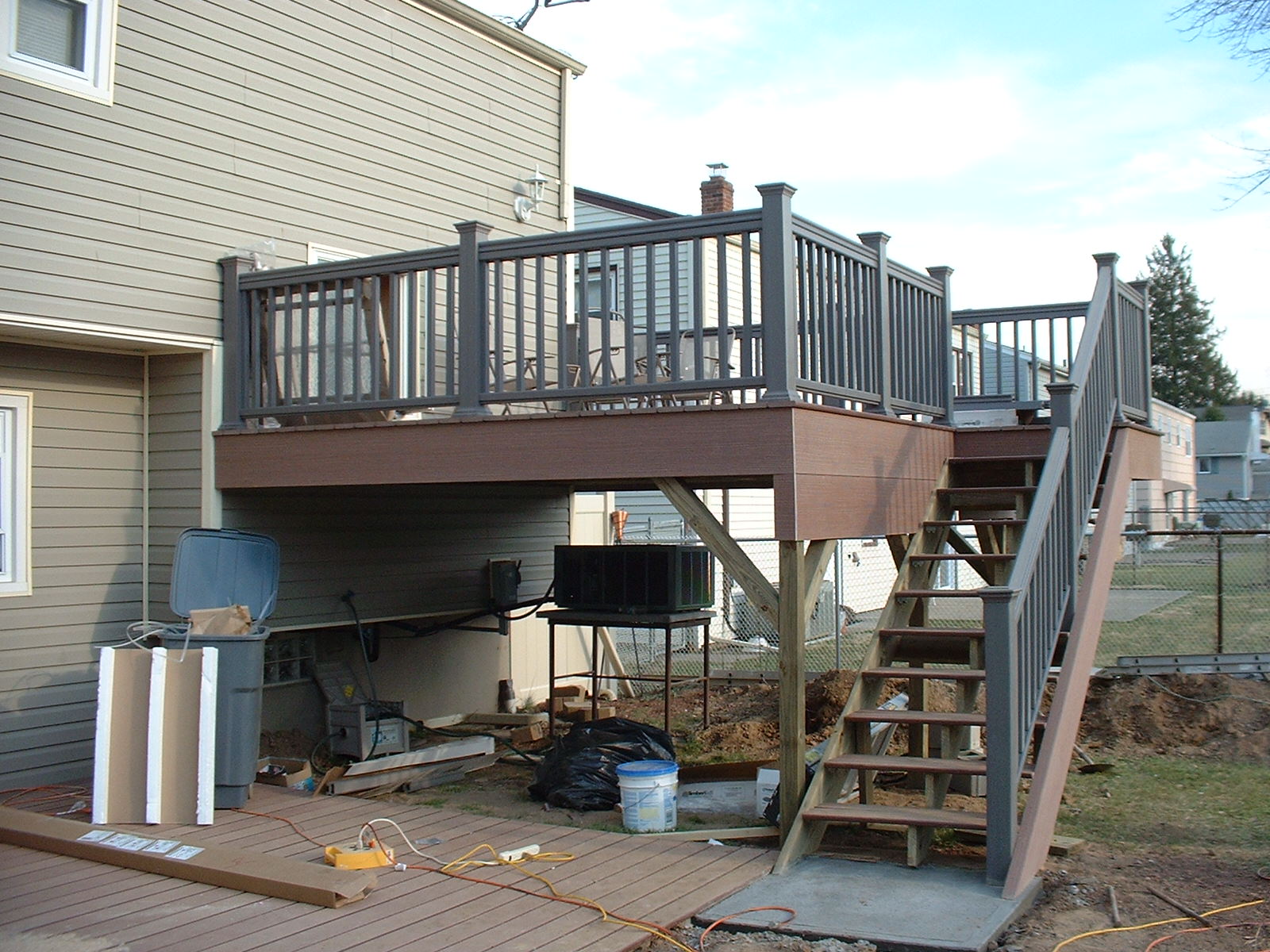 Both decks are now finished and a concrete pad is poured for the bottom of the stairs.