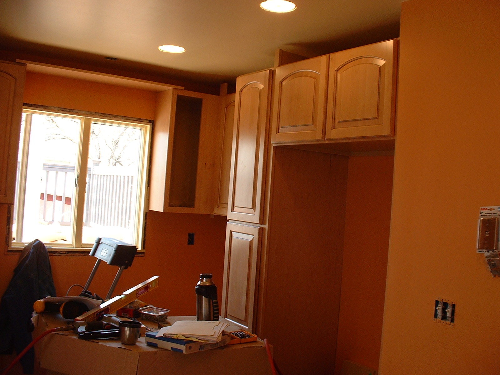 The upper cabinets are almost finished, and the doors are on.