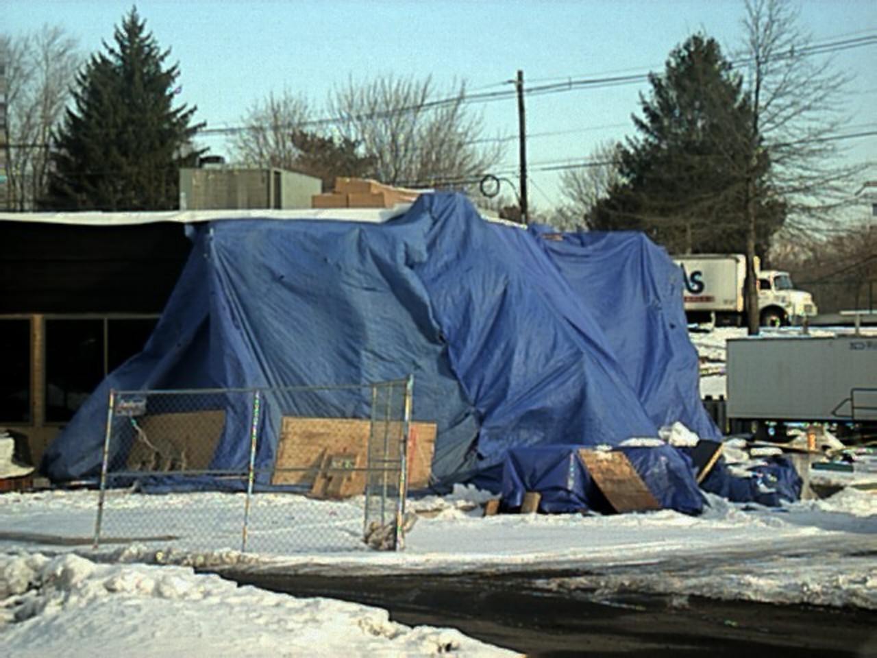 Another view of how the wind sucks the tarps close to the scaffold. It's like being in a giant blue lung.